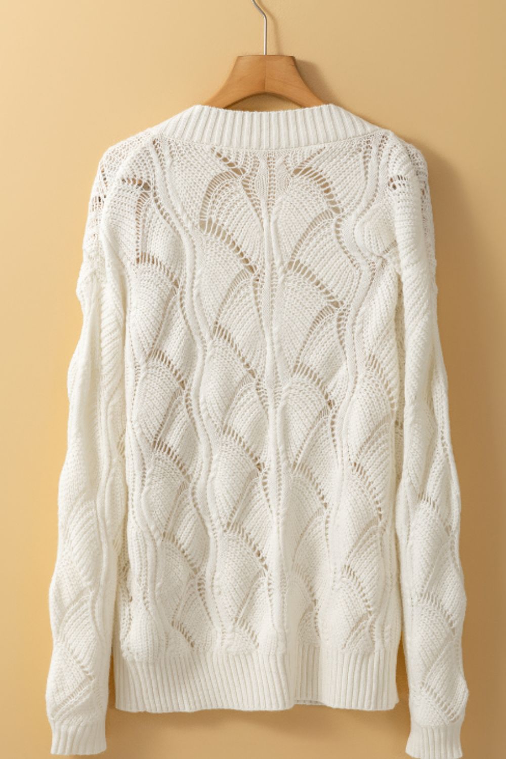 Sienna - Pull à col en V avec design ajouré et manches longues pour femme