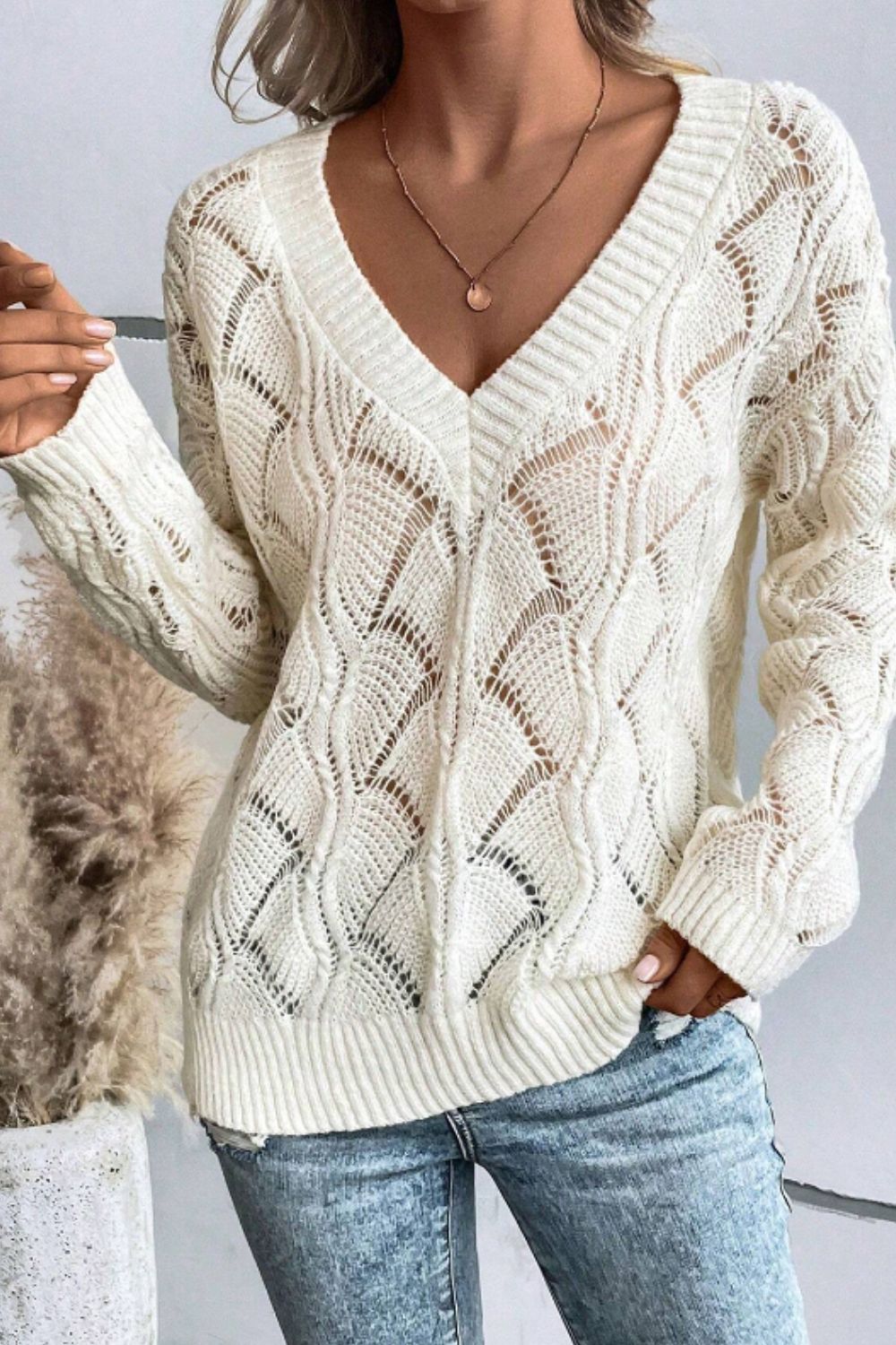 Sienna - Pull à col en V avec design ajouré et manches longues pour femme