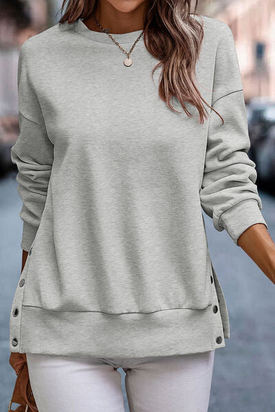 Pull col rond avec détails pressions