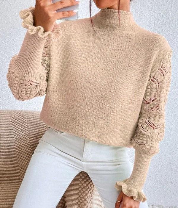 Pull abricot clair avec manches longues et motifs spectaculaires