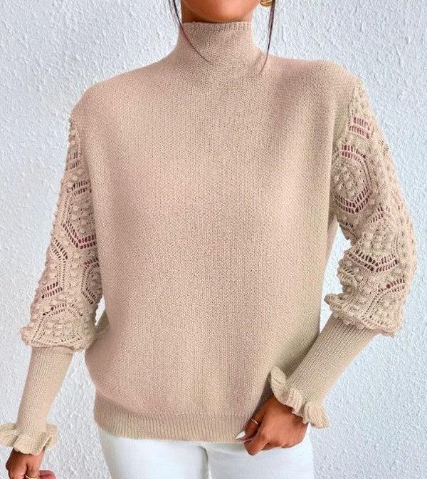 Pull abricot clair avec manches longues et motifs spectaculaires